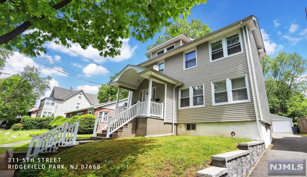 Seize the rare opportunity to own the well-maintained, lovely 2-family home on a large 50x120 lot. Each unit has a private entrance, both units are bright with hardwood floors throughout and high ceilings; The FIRST FLOOR unit enters a spacious living room, separate dining room, eat-in kitchen, 2 bedrooms with an extra room (to make into an office or 3rd bedroom, and plenty of closet space. The SECOND FLOOR unit, a mirror image of the first floor unit, leads to a large attic for storage. There is a separate entrance from the backyard to a full basement (with a powder room, washer/dryer hookups and separate utilities). The backyard has a fire pit (to entertain with bbq, etc). The long driveway leads to a 2 car detached garage that allows for minimum 4 cars to park. Only 5 minutes from the quaint downtown with local restaurants, conveniently located close to all major highways (I-80 Express, NJ Turnpike) and easy commute to NY.