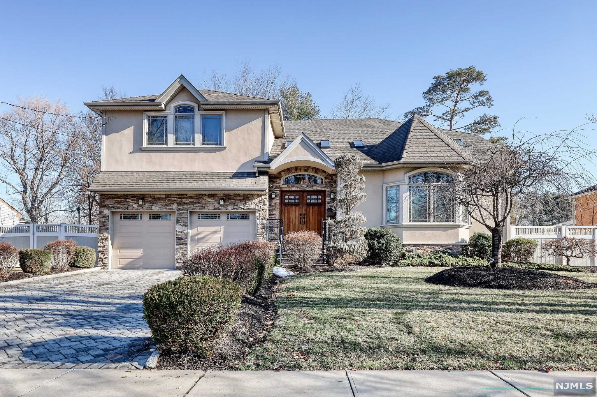 THIS ABSOLUTELY STUNNING, MOST GORGEOUS HOME IS LOCATED IN THE HEART OF FAIR LAWN IN THE DESIRABLE RADBURN AREA! THIS AMAZING HOME OFFERS LUXURY LIVING WITH AMENITIES THAT ARE PERFECT FOR GRACIOUS ENTERTAINING AS WELL AS A CASUAL FAMILY LIVING AND RELAXATION. AMAZING OPEN FLOOR LAYOUT FEATURES AN IMPRESSIVE 2 STORY FOYER ENTRY LEADING TO A DRAMATIC LIVING ROOM WITH CATHEDRAL CEILING/SKYLIGHTS, FORMAL DINING ROOM, FAMILY ROOM/FIREPLACE/SGD TO OVERLOOKING DECK AND FENCED BACK YARD, SPACIOUS MODERN EAT-IN KITCHEN, 1.5 BATHS, BEDROOM AND PLENTY OF CLOSETS. 2ND FLOOR OFFERS A LARGE MASTER SUITE/FIREPLACE,BEVELED CEILING/JACUZZI BATH, PLUS THREE SPACIOUS BEDROOMS AND FULL BATH. A HUGE FINISHED BASEMENT WITH 8' CEILINGS AND TILED FLOORS, LARGE FAMILY ROOM, FBATH, LUXURY 10 SEAT MOVIE THEATRE/ 7.2 SURROUND SOUND SYSTEM, PROJECTOR/HIGH DEFINITION SCREEN, KITCHEN. CENTRAL AC SYSTEM WITH COMMERCIAL STRENGTH DEHUMIDIFIER. PLENTY OF CLOSETS AND STOREGE. 2 CAR GARAGE AND SO MUCH MORE!