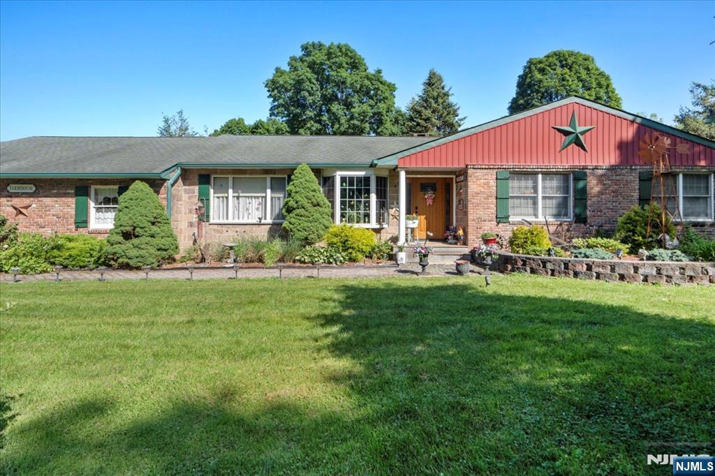 Welcome to this versatile 4-bedroom, 2.5-bath ranch on a stunning 34-acre lot along Warwick Turnpike near Hewitt, West Milford, and Warwick, NY, with easy access to Bergen County. Interior highlights include hardwood, tile, and carpeted flooring, an eat-in kitchen with center island and built-ins, a formal dining room, and a family room with fireplace. The primary suite is on the first floor and features a walk-in closet and en-suite bath with stall shower. There's also a full unfinished basement and an attached 1-car garage with door opener. Outdoor features include a massive 100x45 barn/stable, five sheds (one used as an animal enclosure), patio, 22 feet above-ground pool, and solar panel field. A propane whole-house generator is also on-site (not yet connected). This farm and forest-assessed property offers over 30 wooded acres ideal for hunting, trail riding, and outdoor recreation. Just minutes to Wawayanda State Park, the Appalachian Trail, downtown Warwick, local wineries, a drive-in theater, and more. Perfect for contractors, horse lovers, or those seeking space, nature, and potential this property is a rare find!