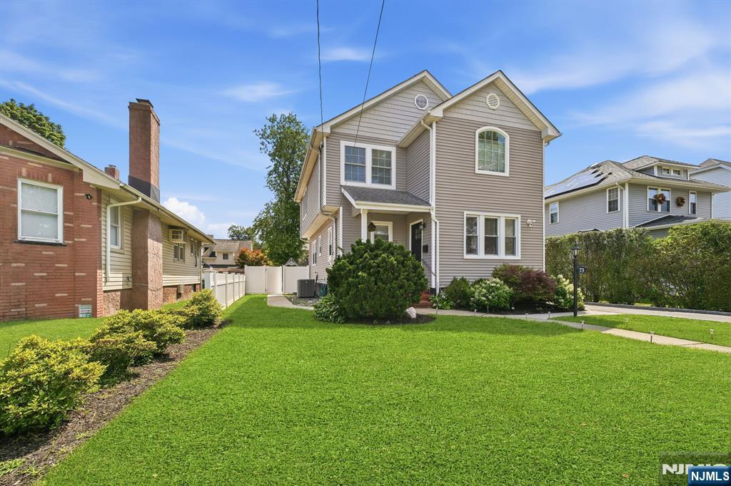 Welcome to this beautifully maintained 4-bedroom, 3.5-bath home offering space, flexibility, and convenience. The main level features a bright living room, a renovated white kitchen with stainless steel appliances, a full bath, and a dining room that was originally a first-floor bedroom and can easily be converted back if desired. Upstairs offers three bedrooms, including a primary suite with a private en-suite bath, plus an additional full bathroom. The finished basement provides even more living space with a finished bedroom, half bath, kitchenette, laundry area, and walkout access to the large backyard. Enjoy outdoor living in the spacious backyard and within walking distance of Saddle River County Park. Conveniently located near Route 80, major highways, shopping, dining, and just a short commute to New York City.