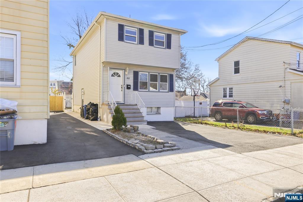 Welcome to 88 Columbus Ave. a Move-In Ready Home located on a Quiet, Residential Street. This Well-maintained property offers a functional layout with modern updates throughout. The main level features an Open-Concept Design Connecting the Kitchen, Dining, and Living Room Areas, complemented by Hardwood Floors and fresh paint. The Kitchen includes Granite Countertops, a Center Island, and Stainless Steel Appliances, including a Refrigerator, Stove, and Dishwasher. The Second floor offers three Bedrooms and a Full Bathroom, providing a practical and comfortable layout. The finished Basement adds valuable living space with Two recreation rooms, a full bathroom, a Laundry area with Washer and Dryer included, and a convenient side entrance. Additional features include a rear deck, Front parking for two vehicles, and Tesla Solar Panels (subscription-based). A great opportunity for those seeking a Turnkey Home with flexible living space in a peaceful setting.