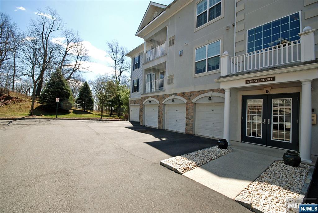 Top floor BEGONIA in a superb location with fantastic views! Enjoy resort style living in this prestigious 55+ gated community. An ideal floor plan with an open feel offering privacy between the bedrooms. A bright kitchen with white cabinetry, ample counter space, breakfast nook & pantry. Primary bedroom suite has an accented tray ceiling; large walk-in closet & luxurious bathroom filled with natural light. Featuring newer HVAC, furnace & hot water heater, plantation shutters and private garage w/storage room. Take in the beauty of nature, colorful trees, a slice of the NYC skyline & sunrise from your balcony and windows. An outstanding 25,000 sq ft clubhouse with the BEST amenities: indoor & outdoor pool, tennis/pickleball, card rooms, Mahjong, putting/driving, fitness center, grand ballroom, clubs, activities & more. Bordering Montclair with terrific restaurants, shops & boutiques. Experience the joy of a carefree & comfortable lifestyle in a peaceful setting!