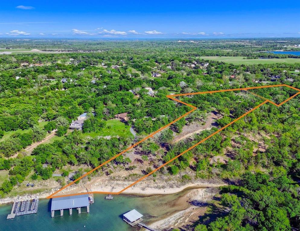 Welcome to Thompson Heights, 5.63 acres of Lakefront paradise, with exclusive ownership to the shoreline, YOU OWN ALL THE TREES! this property offers a rare opportunity to immerse yourself in the natural beauty of one of Texas' most coveted destinations. The possibilities are endless with ample space to design and build your dream home. THIS PROPERTY INCLUDES A BRAND NEW 50 FT. 4 SLIP BOATHOUSE WITH POWER AND WATER, ensuring effortless access to endless days of boating, fishing, and water sports. Additionally, a private dock offers a secluded spot to cast a line, soak up the sun, or simply enjoy the peaceful ambiance of lakeside living. Situated just moments from EISENHOWER STATE PARK, restaurants, and recreational amenities, you'll have everything you need at your fingertips while still enjoying the tranquility of your own private oasis. Don't miss your chance to experience the ultimate lakefront lifestyle.