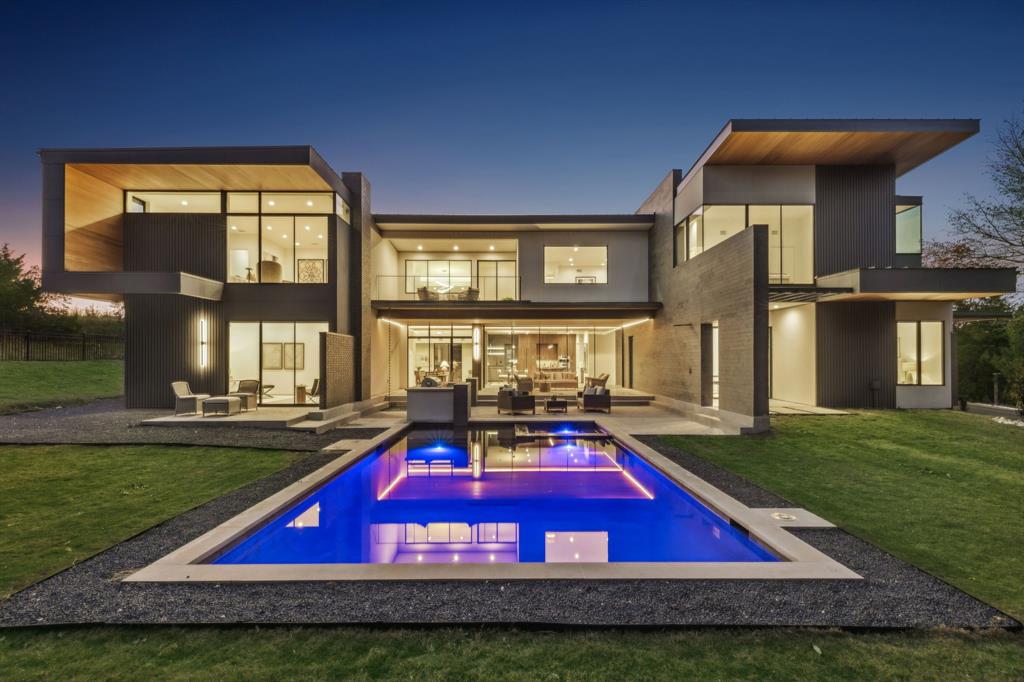 Imagine that your drive home is one of the highlights of your day. While others endure the stress of their commute, you veer off the main thoroughfares towards a home that was created to restore balance and harmony in life. A home so intentional that it’s taken more than a decade to realize.  Welcome to “Harmony House.”   An elite sanctuary that integrates masterful architecture with the beauty of nature.  Only 45 minutes from the heart of Dallas, a winding road ventures through the trees, alongside a stream and past a quaint winery. This evokes a sense of rejuvenation expected from a luxury vacation retreat. Entering  the private drive to your 2 acre, heavily wooded estate, you are reminded that THIS is what you’ve worked for.  Inspired by the philosophies of Frank Lloyd Wright, this architectural gem captures the essence of nature in every room. It indulges the senses with the healing sounds, scents and imagery of the forest; while offering the sophisticated amenities of an architect designed modern home.  The gentle rolling terrain is home to more than 400 trees. A private nature trail winds through the trees to an outdoor cinema, dining area and sunset viewing perch. There are clearings in the woods for future cabins to be constructed to enhance the lifestyle of the residents. Inside, the floor plan offers flexibility beyond single family living. Whether used as a primary residence or a luxury vacation home, the property offers exquisite entertaining spaces, serene bedroom suites and multi-functional spaces that provide an array of uses. There are 3 living areas, 2 kitchens, 2 offices and a storm shelter. The house is prepped for an elevator & wine cellar.  Proximity to the new TKI Airport, makes this a valuable proposition for a family investment. Experience this property, created by an award winning design team: Private tours given to buyers with proof of funds. Semi private tours arranged monthly for up to 10 prospects. Reserve your tour today.
