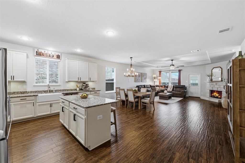 Welcome home to West Fork Ranch, one of North Fort Worth’s most sought-after PULTE communities with award-winning Keller ISD! This stunning 3-bedroom, 2-bath + dedicated study or playroom checks every box with an open-concept layout with wood-look tile throughout main living areas, The showstopper kitchen features crisp white cabinetry, granite countertops, a farmhouse sink, stainless steel appliances, and an island made for hosting.  Cozy up by the stone fireplace in the living room or take the party outside to your covered patio + 12x24 extended outdoor living space with lighting, perfect for evening hangs and weekend cookouts. The primary suite is your personal retreat with garden tub, separate shower, dual sinks, and a walk-in closet. Bonus: large utility room with built-ins and room for 2nd fridge. The community delivers big with two pools, playground, dog park, and scenic walking trails. You’re also minutes from the restaurants and shopping of Alliance Town Center, H-E-B, Costco, Target, and Texas Health Harris Methodist Alliance, plus a quick 15-minute shot to the Fort Worth Stockyards, Downtown Fort Worth, and Sundance Square. This one has it all... so don’t sleep on it! OPEN HOUSE  SATURDAY 20th -1 PM - 3 PM