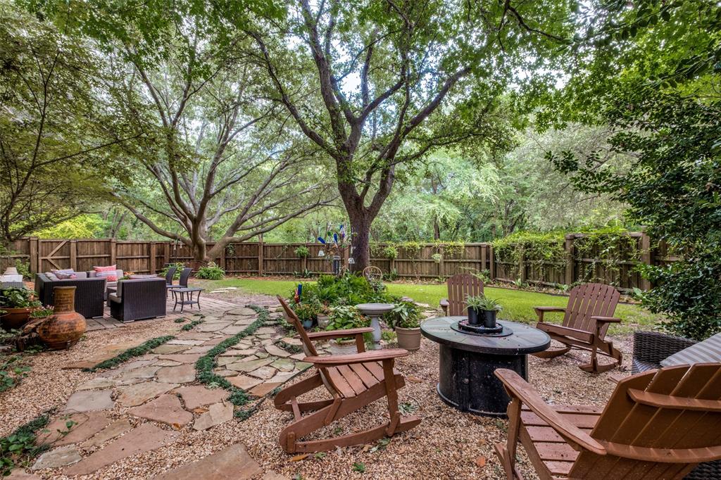 Tucked inside the gated Enclave at White Rock, this home enjoys one of the community's most desirable settings with a backyard that borders a greenbelt and mature trees, creating a sense of privacy that is hard to find in the city.

The floor plan offers a rare combination of flexibility and function, featuring a primary suite on the first floor, a second primary suite upstairs, multiple living and dining spaces, and a game room that can adapt to a variety of needs. Large windows throughout the home bring in natural light and provide views of the surrounding greenery.

The kitchen serves as the hub of the home with an oversized island, breakfast bar, pantry, gas cooktop, microwave, warming drawer, and recently painted cabinetry. The first-floor primary suite includes a spacious bath with dual vanities, a garden tub, separate shower, and walk-in closet. Recent updates include engineered wood flooring downstairs, new stair finishes and carpet, updated kitchen appliances, replacement windows, foundation work, a new downstairs HVAC system, and a wood privacy fence. Refrigerator, washer, and dryer will remain with the property.

Residents of Enclave at White Rock enjoy gated access, walking and biking trails, greenbelt areas, and a quiet neighborhood atmosphere just minutes from White Rock Lake, the Dallas Arboretum, Casa Linda Plaza, Lake Highlands, and Downtown Dallas. With convenient access to outdoor recreation, dining, shopping, and major commuter routes, the location offers a balance of natural surroundings and everyday convenience.