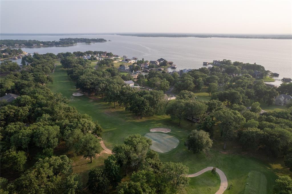 Gated country club living on the shores of Cedar Creek Lake! This large corner lot sits walking distance to the shoreline nestled in the Pinnacle Club 18 hole golf course community. This is more than a neighborhood. It offers social membership as part of the POA dues to include access to the many amenities in this very active neighborhood! The social membership including use of the fitness facility, tennis, pickleball, pool and dining, you can also add a golf membership to enjoy afternoons with friends out on the fairways! The 18 hole golf course is ranked among the top courses in Texas and offers stunning scenery and surroundings! This particular lot being on a corner and just short of a half of an acre, you have all of the space to bring your large single story home design or draw in the multi car garage you have been wanting. This is an ideal community for weekend escape to tranquility or full time living and being as active and involved as you desire! So many engaging clubs to meet and mix with your fellow lake lovers! Just one hour southeast of Dallas, you exit to a quieter, calmer way of life! Come out and take a look at one of the largest lots available in this pristine neighborhood filled with deer who decorate the scenery and lots of fun, active neighbors who love this East Texas escape from the metroplex! This tract is on the corner of St Andrews Dr and Augusta.