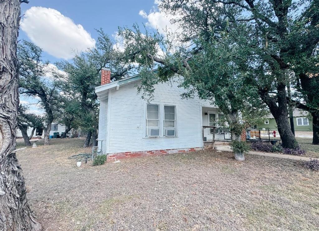 This 3 bed, 1 bath home sits on two lots totaling 0.49 acre, offering plenty of space inside and out. The living room flows into the dining area and kitchen, creating an easy layout for everyday living.

Out back, there’s a separate 1 bed, 1 bath guest house with its own kitchen and living area — great for a rental, guest space, or mother-in-law suite. The property also includes two storage sheds, a patio area, and lots of big shade trees throughout the yard.

With some work, this place could really shine. Whether you're looking to fix up your next home or invest in a potential income-producing property, this one has a lot of potential and room to grow. Being Sold AS IS.