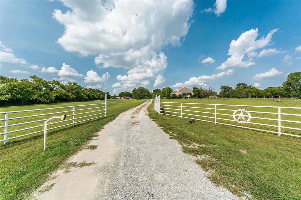 Rare and Beautiful Ranch style move-in ready and refurbished home on an approx 9  acres landscape, Resort style pool and a 1 acre pond with fishing pier.  More than 735'(approx)  of frontage on Prosper Trails. Gated property. Property has fencing for the housing (approx 1.63 ac) and rest Pasture Lands. The home is in the middle of prosper yet surrounded by serene and beautiful golf courses (very close to Gentle Creek Golf Course) and ranch homes. You will miss this if you don't see the home.