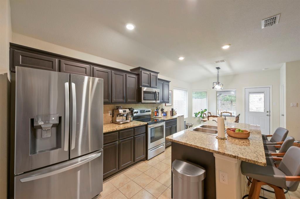 Welcome to 600 Stanmire Lake Trail, where style, comfort, and convenience come together in one beautifully maintained home. This thoughtfully designed single-story floor plan offers an open-concept layout filled with natural light, creating the perfect space for both everyday living and effortless entertaining. The spacious kitchen serves as the heart of the home, featuring granite countertops, stainless steel appliances, abundant cabinetry, a large center island, and a walk-in pantry, all flowing seamlessly into the dining and living areas. The private primary suite offers a relaxing retreat with an ensuite bath, dual sinks, and an oversized walk-in closet, while three additional bedrooms provide flexibility for family, guests, or a home office. Step outside to enjoy the extended covered patio with pergola, an ideal setting for morning coffee, weekend barbecues, or evenings spent unwinding. Situated on a desirable corner lot in the growing Trinity Oaks community, you'll enjoy convenient access to major highways, shopping, dining, and everything Fort Worth has to offer. This home delivers the perfect blend of modern finishes, functional living, and exceptional value. Don't miss your opportunity to make it yours!