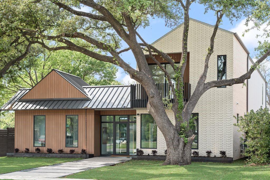 A striking new construction home by an award-winning team, this modern residence blends architectural design with everyday livability. Set on a magnificent, oversized, tree-filled lot in Midway Hollow, the home is framed by mature oak trees and thoughtfully designed landscaping, creating a private and inviting setting.  

The exterior showcases a standing seam metal roof, custom fencing, and clean modern lines, while expansive 10’ windows and sliding doors fill the home with natural light and seamlessly connect indoor and outdoor living. Inside, soaring ceiling heights elevate the space, with 11’ ceilings in the main living areas and dramatic 16’ to 18' gabled ceilings in the primary suite, office, workout room, and guest bedroom.

The open-concept living and kitchen area is both refined and functional, featuring a large island, GE Profile appliance package, custom cabinetry, and a butler’s pantry designed for effortless entertaining. Warm wood accents, smooth finished walls, and custom tile work add depth and texture throughout.

The spacious primary suite offers a private retreat, complete with a spa-inspired bath and custom closet system. Designed for flexibility, the home includes multiple living areas, a dedicated office, workout room, game room, mudroom, and two laundry rooms.  

Outdoor living is equally intentional, with two oversized covered balconies, a covered patio, and a custom acid-washed walkway, all surrounded by drought-tolerant landscaping for ease of maintenance.

Built with 2x6 framing, engineered slab on piers, and full foam encapsulation, this home delivers exceptional efficiency, quality, and design—crafted to stand apart.