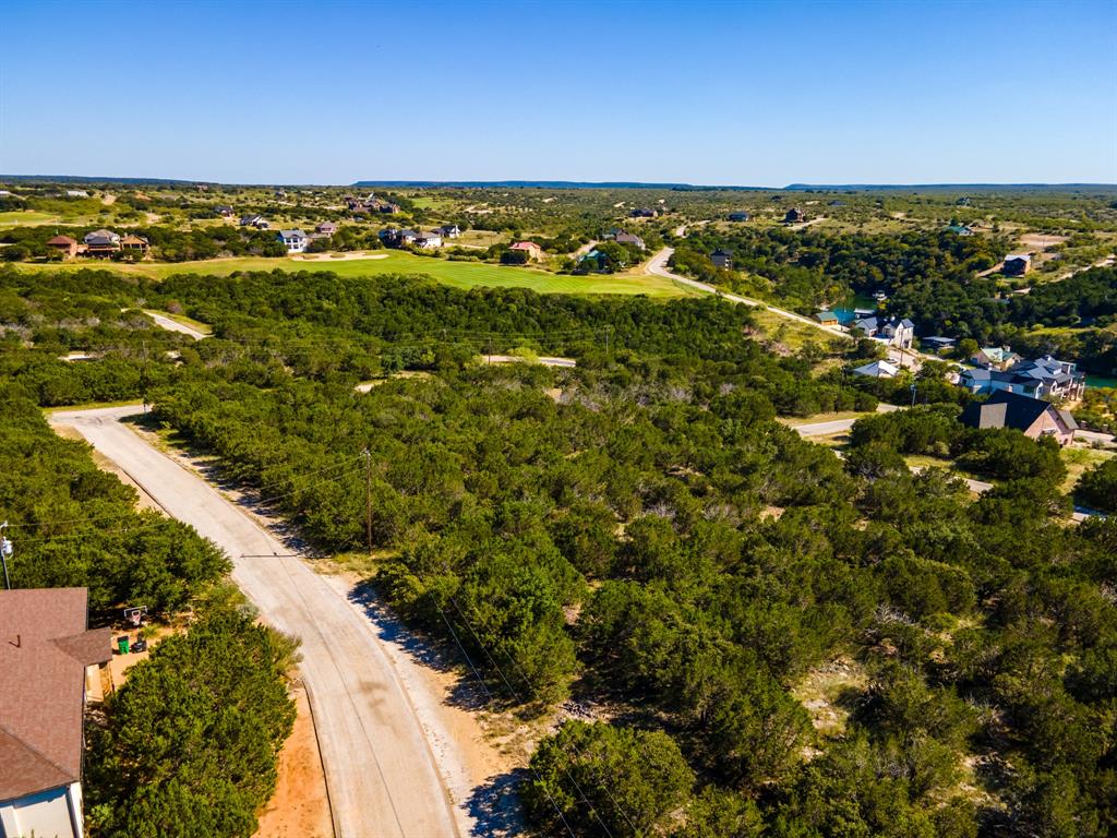 Mostly level lot on secluded private street. Lots of trees that you can pick and choose for your yard. Second floor has potential for a golf course view. Lot is located in Phase 8 of the Cliffs, one of the more highly sought after phases.  Ownership gives access to many amenities; 18-hole Championship Golf Course, Chaparral Grille and Spurs Bar, Marina and Ship Store, Hotel, Conference Center, Spa, Fitness Center, 2 Swimming Pools, Tennis Courts, Playground, Parks and more. Owners receive 36 complimentary rounds of golf per year. This is a gated and guarded community, so contact an agent to schedule a time to get access and tour The Cliffs Resort.