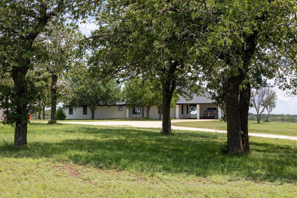 Beautiful Land! If you are a fan of scattered, groomed oaks, then this is your property! This cattle ranch is very pretty and well set up for working stock. Or if you have horses, you could easily convert the 6 large pipe pens with shelters into horse pens!  Fenced and cross fenced with good fencing. The 3 bed, 2 bath home has recently been updated and also has an extra half bath and bonus room under the carport. There is a pool and hot tub for outdoor fun with gorgeous views! Come see this property- and see the possibilities!