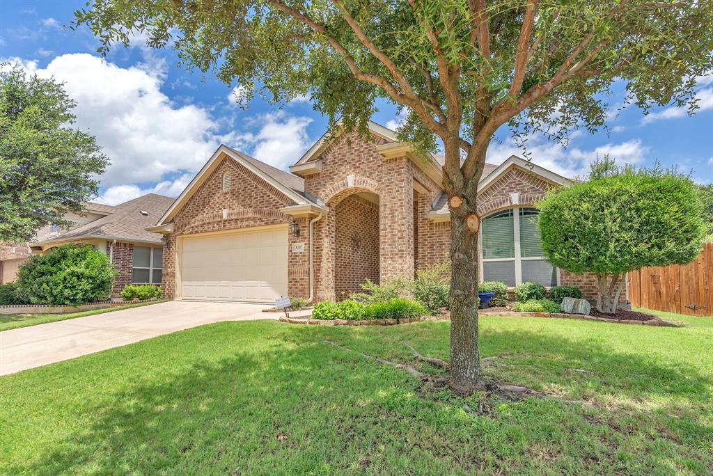 Lush landscaping creates stunning curb appeal for this beautiful 3-bedroom, 2-bath home with a 2-car garage. Inside, you’ll find granite countertops, stainless steel appliances, and a refrigerator, washer, and dryer that all convey with the property. The kitchen and bathrooms feature tile flooring, while the living areas and bedrooms offer comfortable carpeting.  Step outside to an oversized covered patio complete with ceiling fans and roll up shades perfect for relaxing or entertaining. The backyard is highlighted by a charming magnolia tree, adding both shade and character. Located in the desirable Cross Oak Ranch community, residents enjoy exceptional amenities including community pool, scenic jogging and biking trails, multiple parks, and a private neighborhood lake just minutes away. This vibrant community offers the perfect blend of outdoor recreation and everyday convenience.