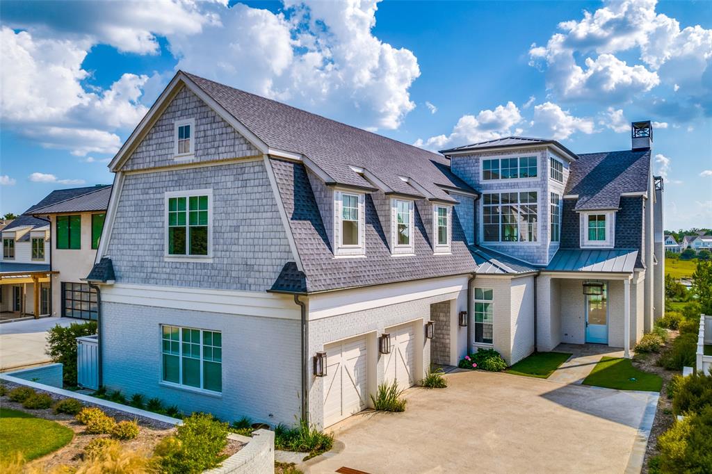 Exquisite fully furnished luxury lake home in premier Long Cove on the shores of Cedar Creek Lake.  This meticulous home is filled with the highest level of designer finishes and fixtures.  The open floor plan perfect for entertaining welcomes guests with water views and a covered porch with phantom screens, built-in grill, fireplace and heat lamps.  The chef's kitchen is equipped with subzero and kitchen aid appliances as well as a spacious pantry and hoshizaki ice maker.  The primary downstairs bedroom and guest suite are wonderful retreats.  The second floor bunk room, game room and bedrooms provide numerous spaces for friends and family to enjoy life at the lake.  Architect John Boyd and Dallas designer Leslie Jenkins collaborated on the home.  Boat and 2 golf carts convey with the property.  This is truly a spectacular offering as a turnkey property with the most curated designer choices!
