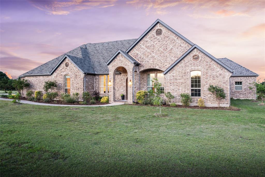 Situated on 2.789 acres in sought-after Lovejoy ISD, this 5-bedroom, 3 full bath and 1 half bath custom home offers an open-concept layout designed for both everyday living and entertaining. Wood floors, spacious living areas, and large windows create a bright and inviting interior, while the expansive floor plan includes a dedicated gameroom and media room for added flexibility. The kitchen opens seamlessly to the main living area and features extensive cabinetry, oversized island seating, stainless steel appliances, and generous prep space. The private primary suite offers views of the backyard retreat along with a spacious bath and walk-in closet. Secondary bedrooms are well-sized with functional separation throughout the home. Outdoor living is a standout feature with a covered patio, outdoor fireplace, resort-style pool and spa, extensive decking, and multiple entertaining spaces overlooking the acreage lot. The backyard combines privacy, open green space, and sunset views, creating a true outdoor retreat.Additional features include a 3-car garage, large utility spaces, and ample room for recreation or future additions. Located in Lovejoy ISD with convenient access to shopping, dining, and major commuting routes while still offering the privacy and space of acreage living.