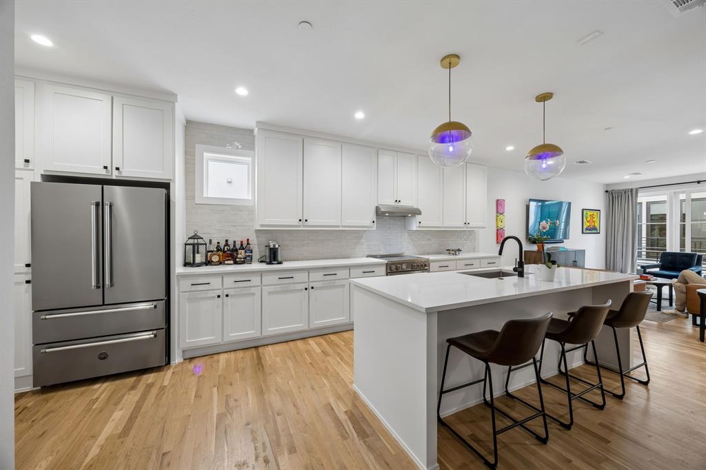 Situated in the heart of Lakewood, this beautifully designed condo blends modern style with effortless comfort in one of Dallas’ most desirable neighborhoods. Located just moments from the scenic trails and recreation of White Rock Lake, this home offers convenient access to miles of biking, running, kayaking, and outdoor exploration.
Inside, the light filled open layout showcases wide plank white oak flooring that flows seamlessly throughout, creating a warm and sophisticated feel. The kitchen is thoughtfully designed for both everyday living and entertaining, featuring a pristine white quartz island and countertops, decorative glazed tile backsplash, classic white shaker cabinetry, and premium stainless steel appliances including a Bertazzoni 36 inch French door refrigerator, induction range, undermount microwave, and sleek under mount sink.
The inviting living area is bright and welcoming with abundant natural light and easy access to the private balcony. The spacious primary suite features a double vanity and an oversized glass walk in shower with designer tile finishes. The secondary bedroom offers architectural character with a striking vaulted ceiling.
The community offers direct access to the scenic Santa Fe Trail, connecting residents to the extensive trail system surrounding White Rock Lake and nearby outdoor destinations including the beautiful Dallas Arboretum and Botanical Garden.
Additional upgrades include Cat5 wiring, epoxy coated garage floor, and HOA coverage that includes water, trash, sewer, and internet. Conveniently located near neighborhood dining, shopping, and the prestigious Lakewood Country Club, this home offers the ideal combination of modern comfort, low maintenance living, and close proximity to everything that makes Lakewood one of Dallas’ most desirable neighborhoods.