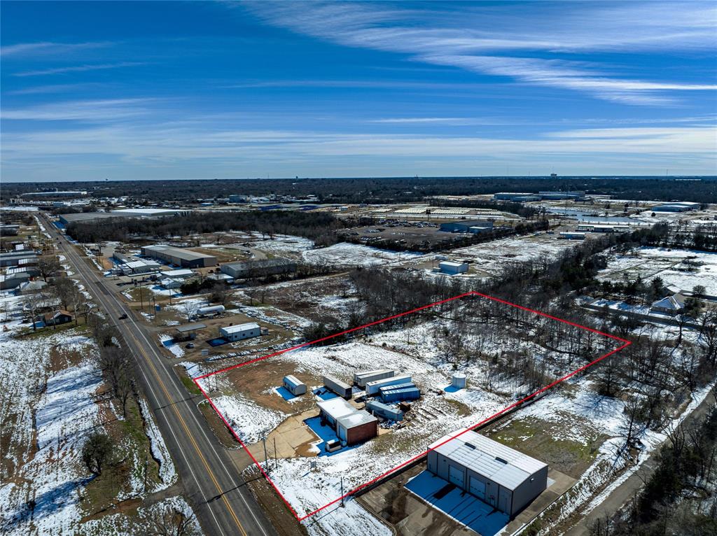 Discover the perfect location for your business with this 4-acre commercial property conveniently situated on FM 79 just half a mile off Loop 286 in Paris. Boasting a 1,718 sq ft warehouse with office space, this property is designed to meet a variety of business needs. Key features include: 3 roll up doors, ample parking space for business operations, and high visibility with an AADT of 6,820 traveling FM 79 daily. The property is equipped with 3 phase electricity, 2 inch water lines, and city sewer. Whether you're looking to expand, relocate, or launch a new venture, this well-traveled and accessible location provides the visibility and infrastructure to help your business thrive.