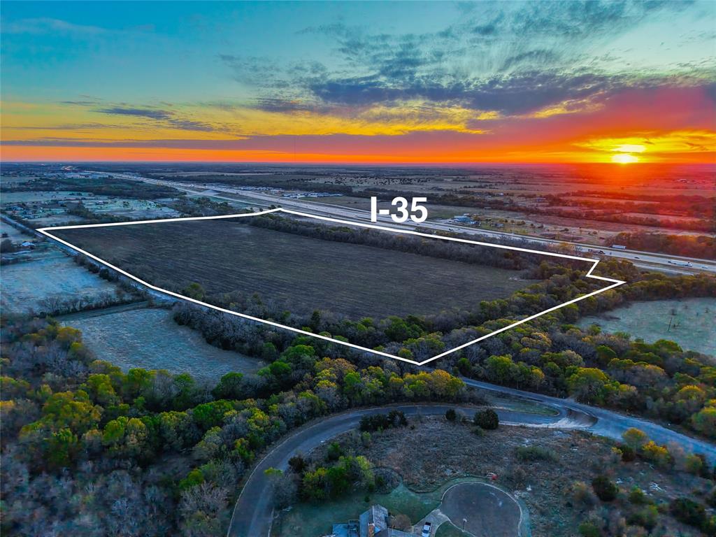 This 76.63± acre tract in Bell County, Texas offers an exciting opportunity to create something special in the heart of Central Texas. With approximately 2,500 feet of frontage along the I-35 access road and an additional 2,200± feet along Old Highway 81, the property provides outstanding visibility and easy access from two sides. This makes it especially attractive for future development. The land features gently rolling terrain with approximately 30 feet of elevation change, giving it character while still being highly usable. Its natural layout offers flexibility for a variety of possibilities, whether you’re considering a residential community, commercial venture, or long-term investment. Conveniently located near Temple, Belton, and Salado, this property strikes a great balance between accessibility and a more relaxed, open setting. With quick access to Interstate 35, you’re within comfortable reach of larger markets like Austin and Waco, positioning this tract right in the path of continued regional growth. Currently undeveloped, the property is a blank canvas ready for your vision. The combination of size, road frontage, and location makes it a standout option for those looking to invest in the future of this growing area.