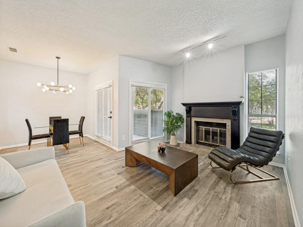 Beautifully renovated first-floor condo in the tree-lined Chasewood Oaks community. This move-in-ready home features luxury vinyl flooring, fresh neutral finishes, a remodeled kitchen with updated appliances including the refrigerator, washer, and dryer, a spacious living room with a fireplace, and a stunning primary suite with dual vanities, an oversized walk-in shower, and a custom walk-in closet. Enjoy a private patio, covered parking, a community pool, and an HOA that covers water, sewer, exterior maintenance, grounds, pest control, and management. Conveniently located minutes from AT&T Stadium, Globe Life Field, Texas Live!, River Legacy Park, Six Flags, shopping, dining, and major highways. Perfect for first-time buyers, professionals, downsizers, or buyers seeking a low-maintenance home or long-term investment.