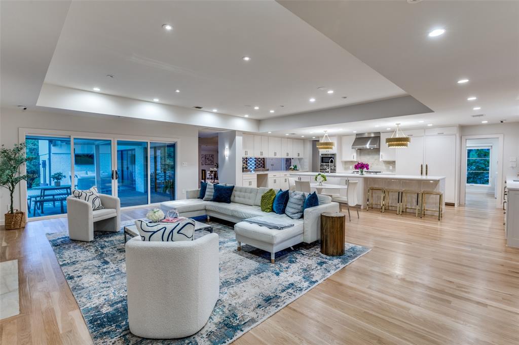 Positioned at the center of the coveted cul-de-sac in the highly sought-after Janmar Estates, this Mid-Century residence is a rare offering—where premier location meets the serenity of a private, tree-lined retreat. Surrounded by mature trees in both the front and backyard, the home is filled with natural light, while walls of windows frame stunning views of the creek-lined grounds—creating a setting that feels both peaceful and expansive.

Designed for both everyday living and elevated entertaining, the home’s spacious interiors flow effortlessly from one room to the next. The formal dining room offers flexibility with open, removable screens, allowing for intimate gatherings or a seamless connection to the main living areas.

The chef’s kitchen is thoughtfully appointed with double sinks, double dishwashers, a warming drawer, and built-in Thermador and Bosch appliances. An oversized island with a buffet-style bar anchors the space, serving as a natural gathering point while opening to the dining and family rooms.

Taken down to the studs in 2015 and recently updated throughout, the home blends timeless Mid-Century architecture with modern comfort. The primary suite offers a true retreat, complete with two separate closets for exceptional functionality and ease.

Additional highlights include a fully encapsulated crawl space and a charming garden walking path, perfect for enjoying the tranquil, tree-filled surroundings. Cherished by only its second owners, the property also conveys a rare 1 of 5 undivided interest in the private greenspace park at the front of the cul-de-sac—shared exclusively among four neighboring homes.