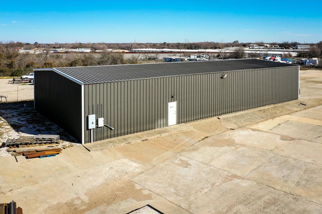 Prime Commercial Opportunity in Kennedale, Texas: Modern Facilities on Spacious Land! These (3) 5,000 sqft. metal buildings are nestled on 5.71 acres, with a secure gated drive. Buildings feature 15 ft. ceilings, 14 ft. wide sliding bay doors, and insulated walls for energy efficiency, each building houses 2 bathrooms and a designated office space. Illuminated with LED lighting and powered by 120-208 3-face power in two of the buildings. Enjoy the ease of keypad entry as you navigate the ample cemented parking area. With two buildings currently leased, this is an investment opportunity not to be missed! Schedule a tour today, call the listing agent. Age of the buildings are approximately 2017.