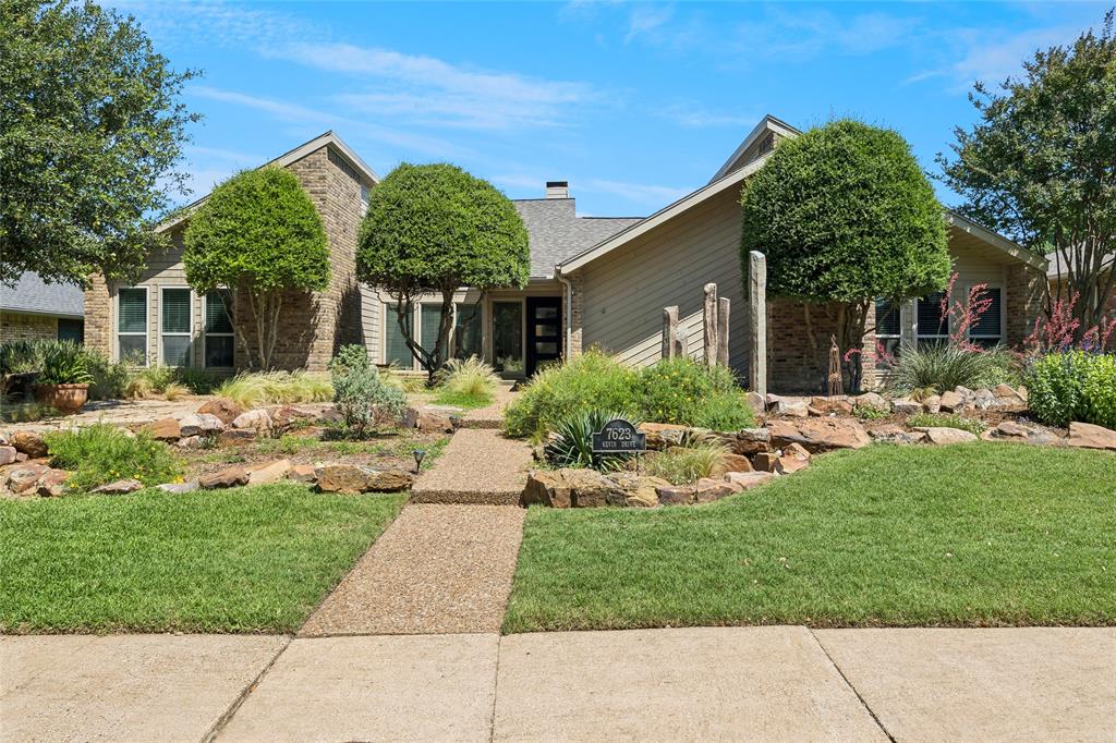 ~OPEN SATURDAY 1:00 PM - 3:00 PM~ Discover this stunning contemporary home, remodeled to blend modern elegance with functional living. Natural light floods the open floor plan, enhanced by skylights that bring the beauty of the outdoors in. The authentic Saltillo terracotta tile adds warmth and charm throughout, while energy-efficient windows ensure comfort year-round. Culinary enthusiasts will appreciate the spacious kitchen overlooking the family room, which features a floor-to-ceiling fireplace shared with the equally large second living area. The generous primary suite offers gorgeous views and direct access to your private, recently refreshed saltwater pool and spa, surrounded by a covered outdoor living area—perfect for entertaining or simply enjoying the serene surroundings. With a rare 3-car garage and thoughtfully designed landscaping that caters to nature lovers, 7623 Kevin Drive checks all the boxes. Located within the exceptional Richardson school district and conveniently close to the University of Texas at Dallas, as well as an array of restaurants and shopping options, this property is not just a home—it's a lifestyle!