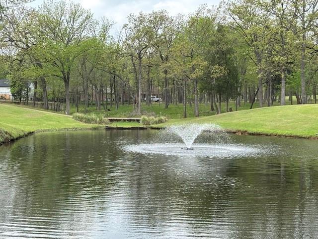 Nestled in the desirable, gated community of Pinnacle Golf Club on Cedar Creek Lake, this secluded, heavily wooded .6-acre homesite offers a rare opportunity to purchase or build-to-suit at a discounted price.  Set within a 18 hole golf course community, residents enjoy access to an exceptional lineup of amenities including a clubhouse, restaurant, pool, fitness center, and brand-new pickleball and tennis courts.  The gently sloping terrain provides stunning views of the fairway and a picturesque pond with a fountain, creating a perfect backdrop for your future home. With ample space for outdoor living, a pool, and thoughtfully designed landscaping, this lot is ideal for crafting your personal retreat.  Soil tests have already been completed and are available upon request, making this an easy and attractive next step toward building your dream home.