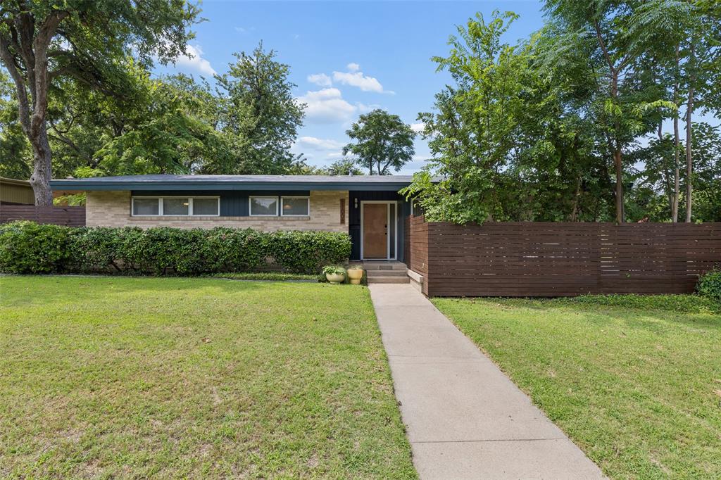 As cool as it gets. Outstanding example of a Highland Meadows Mid-Century Modern, situated on a quarter-acre corner lot, boasting awesome MCM accents such as push-button light switches and funky lever-style doorknobs, and augmented with contemporary flair. Great drive-up appeal with low-maintenance landscaping, looking great from both street views. Sleek entryway with polished flagstone floor gives way to gleaming hardwood floors. Living-dining-kitchen combo are both open and provide a sense of separation. Large dining area, flowing to kitchen with window cutout to living room. Kitchen with quartz waterfall counter, undermount sink, recent dishwasher, incredible original folding electric stove (still working!), original cabinetry, storage & breakfast area. Living room is just right, cozy but perfect for guests. Bedrooms are nicely-sized, 3rd bedroom with French doors opening to living room. Exquisitely-updated master and hall baths, maximizing space and bringing in modern style. 2-car carport, funky rock-climbing wall along back wall of carport. Huge backyard with wood privacy fence, entertaining space on far end with concrete pads & gravel, with rope lighting & so much more. A rare opportunity to own a Mid-Century masterpiece!