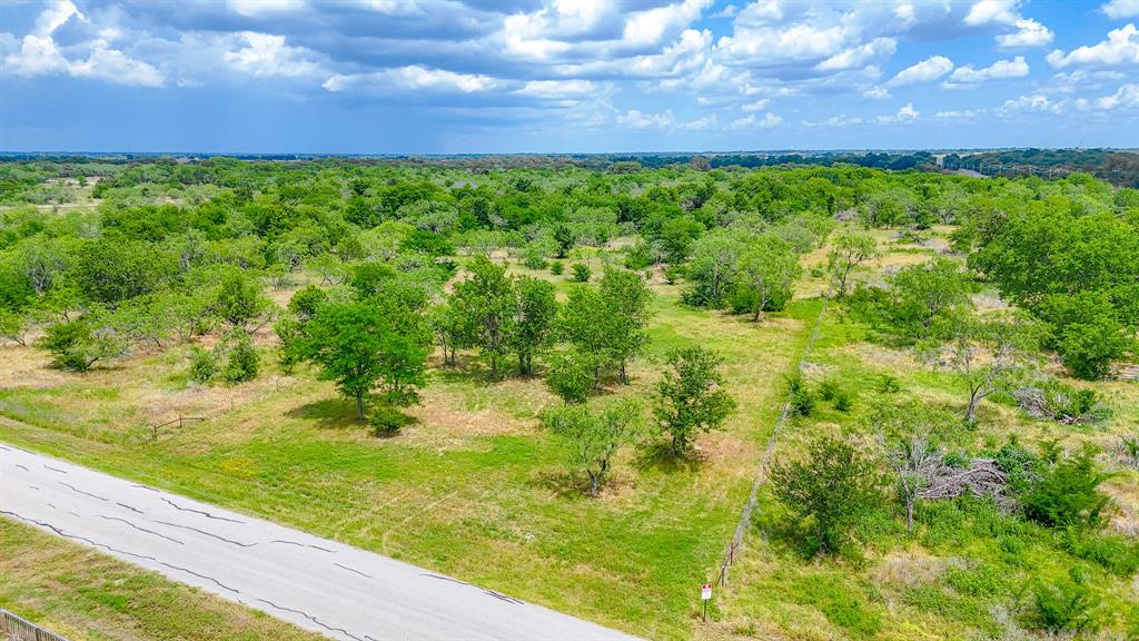 Escape the city and embrace the peaceful charm of country living on this beautiful 2-acre tract in the desirable Wolf Ranch community just outside Corsicana. Surrounded by scattered mature trees and wide-open Texas skies, this property offers the perfect setting to build your custom dream home while enjoying the privacy and tranquility of rural living. The gently wooded landscape creates a scenic backdrop with plenty of space for outdoor living, a workshop, garden, or room to simply spread out and enjoy the countryside. Conveniently located with easy access to I-45, you can enjoy the quiet of country life while still being just minutes from Corsicana and under an hour from the Dallas Metroplex. Deed restrictions help maintain the quality and integrity of the community, making this an excellent opportunity to create your ideal retreat in a growing area.
