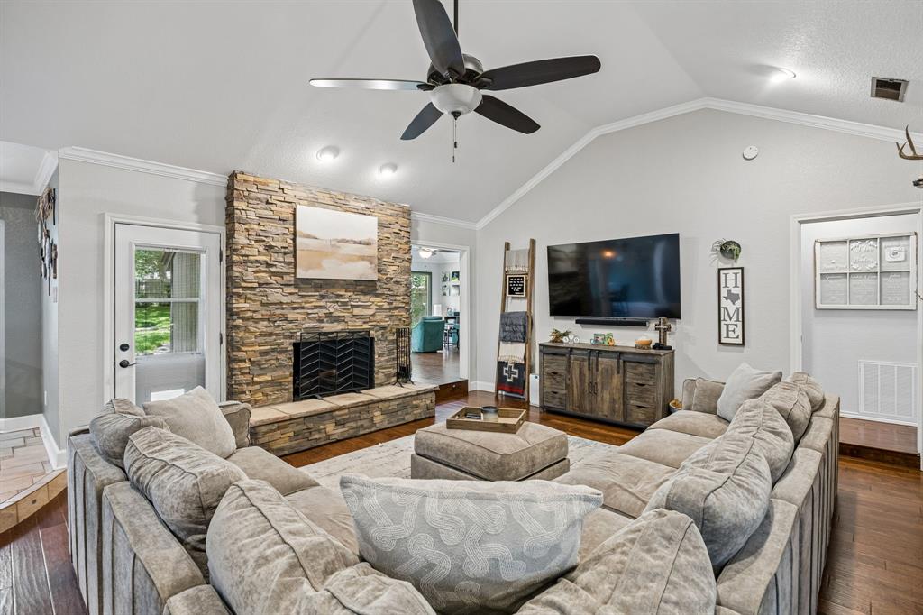 Welcome to this beautifully maintained Huntwick home, perfectly situated on a spacious corner lot shaded by mature trees and featuring an expansive backyard designed for relaxing, entertaining, and outdoor enjoyment. Recent exterior improvements include updated irrigation, new backyard sod, an enhanced flagstone patio, and a storage shed that provides additional functionality.

Step inside to discover a thoughtfully designed floor plan that combines comfort, style, and functionality. Fresh interior paint throughout creates a bright, move-in-ready feel, while rich wood flooring enhances the living room, where a stunning stacked stone fireplace serves as a warm and inviting focal point. The kitchen offers added convenience with a recessed water line behind the refrigerator, making installation simple.

Entertaining is effortless with the oversized game room, elegant formal dining room, and well-appointed secondary bedrooms that provide flexibility for family and guests. A charming bay window fills the breakfast area with natural light, while energy-efficient windows help improve year-round comfort and reduce utility costs. The oversized utility room adds exceptional functionality and includes a convenient half bath with a granite vanity.

Additional highlights include epoxy-coated garage floors, providing both durability and a polished finish. Located within the highly regarded Arlington ISD, serving Dunn Elementary, Young Junior High, and Martin High School, this home offers an outstanding combination of timeless charm, thoughtful updates, and an exceptional location. Don't miss the opportunity to make this exceptional Huntwick property your next home.