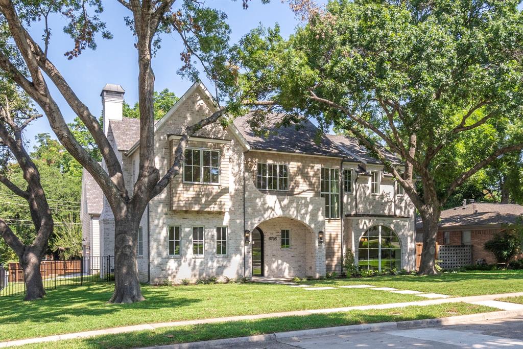 New construction home with custom level finish out in coveted Lake Highlands attendance zone on one of the most desired streets in LH. This two story, 5 bed 4 bath, and 2 addtl powders is a Tudor style home designed by architect Eric LaPointe. On drive up it boasts cedar shake, curved lines, arched windows and washed brick. Inside the home is full of luxury finish out. Situated on a tree lined corner lot.  Hardwoods throughout, Ann Sacks tile, custom, job built cabinetry, beveled casements openings downstairs, marble counters in kitchen and primary, masonry wood burning firebox in living, premium, Pella casement style windows, custom floorboards and crown moulding. Two primary beds with main primary up. Downstairs primary has wd hookup in closet. Laundry room up. Bonus room with ensuite bath above garage. Each bedroom is equipped with ensuite bath.  Large covered porch with outdoor kitchen and fireplace.  Top of the line SS appliances and built in fridge.