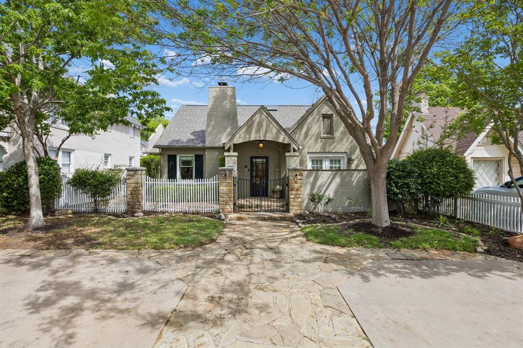 Back on market - no fault of house. Tucked behind a classic white picket fence, this home welcomes you with warmth and timeless charm. Designed in a cottage-inspired style, the home thoughtfully combines inviting comfort with elevated, designer finishes. Inside, soft, airy tones set the stage, with light pastels enhancing the living and dining areas. A dedicated office offers a striking contrast, featuring rich green walls, custom built-ins, and doors that open directly to the backyard—creating both functionality and character. Every space feels intentionally balanced, blending everyday livability with refined design. 

The primary suite offers a private escape, complete with a spacious walk-in closet, French doors leading to a courtyard, and a beautifully designed bathroom. Here, dual vanities are topped with light quartz countertops and accented by gold fixtures. Modern lighting pairs seamlessly with classic wainscoting, while glass block details invite natural light in without compromising privacy.

Upstairs, two additional bedrooms provide comfort and charm, including one with a built-in bed, integrated shelving, and plantation shutters that allow soft natural light to fill the room. The upstairs bathroom continues the home’s thoughtful design, featuring calming blue tones, dual sinks, and a separate area with a tub-shower combination, all enhanced by elegant gold accents.

In the last year the owners have also replaced the roof, put a new cover on the patio, newly installed a 2015 commercial grade tankless hot water heater, had electric upgrades and added new tile in the laundry room!

All of this is ideally located within walking distance of some of Fort Worth’s finest dining, shopping, and country clubs, offering both convenience and an exceptional lifestyle.