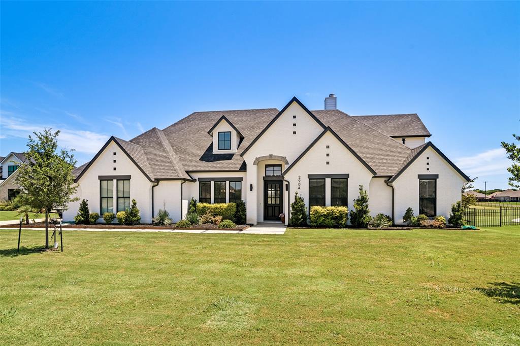 Welcome to Ennis and 2904 Terrytown Dr., situated on nearly half an acre in gated Sleepy Hollow Estates overlooking Meadow View Nature Area, a protected natural open preserve. This stunning 4 bedroom, 4 bath home offers 3,922 square feet of living space.  The inviting layout includes a main-level primary suite with spa-inspired bath, two additional ensuite bedrooms, an open kitchen and living space, plus separate dining and breakfast areas. Upstairs offers another living area, media room, the fourth bedroom and full bath, balancing comfort and functionality.  
Discover this charming town just south of Dallas, a short 25-minute commute to downtown Dallas. As the “Official Bluebonnet City of Texas”, Ennis is home to Texas’ oldest known bluebonnet trail. The town offers a variety of festivals and year-round events, attracting outdoor enthusiasts interested in recreation, water sports, hunting, fishing, boating, and a relaxed lifestyle. A revitalized historic downtown area offers small town charm for those who enjoy community theater, museums, local shopping and dining. Come visit Ennis and see this remarkable property!