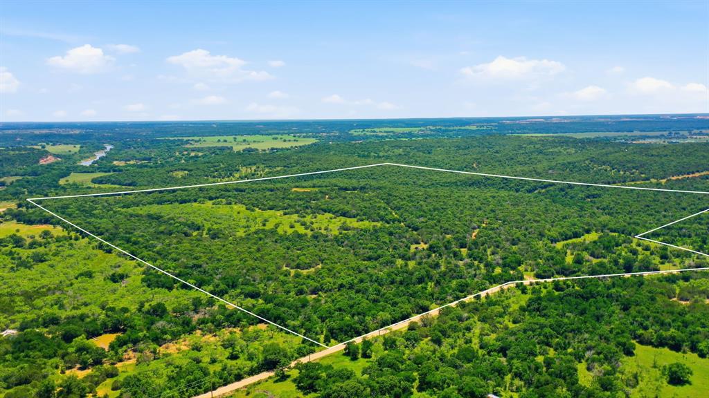 First time ever offered to the market, this 154 acre property in Millsap has been held in the same family since the late 1800’s. Tucked away in Palo Pinto County, the land is absolutely covered in mature trees, has massive rock features, major elevation change, and great views. A creek winds through the property, adding to the beauty and making it an ideal recreational tract or hunting ranch. Whether you’re looking for a weekend retreat, hunting property, or long-term investment, this is the kind of land that rarely becomes available. With generations of history behind it and natural beauty throughout, this ranch offers a unique opportunity to own a piece of Texas that has been preserved for well over a century.