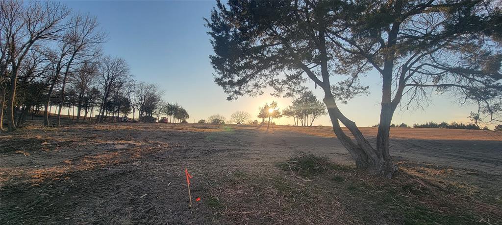 One of the most stunning locations in Waxahachie! 2.205-acre lot in a peaceful, private community. Ideally located just outside the city limits, you’ll enjoy lower property taxes and fewer restrictions, giving you the flexibility to create the lifestyle you want. Conveniently situated approximately 30 miles from both Downtown Dallas and Fort Worth, this property offers easy access to city amenities while maintaining the quiet charm of country living. The lot has already been cleared and is ready for your build. Whether you're planning a custom home, workshop, guest house, or even space for a horse, the possibilities are wide open. Enjoy access to scenic Twin Lakes for fishing and relaxation, all within a serene setting that feels worlds away from the hustle and bustle. Don’t miss this rare opportunity to own acreage that truly offers the best of both worlds—space, freedom, and convenience. Your Dream Homesite may be closer than you think...Financing available with 15% Down!