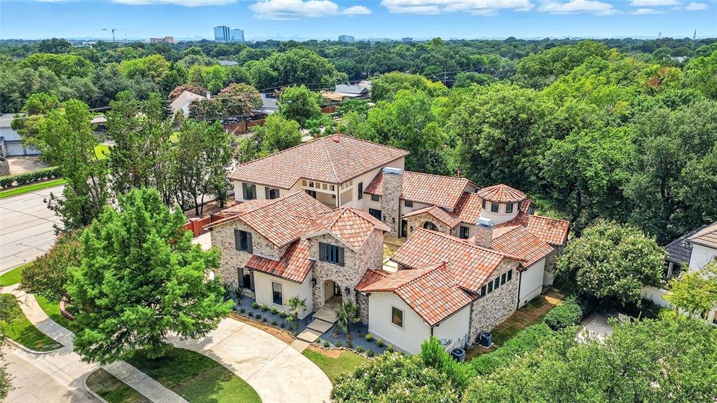 THIS IS THE ONE! This gorgeous 5 bed 5.5 bath Mediterranean estate is straight out of a magazine. Enter into the private courtyard, which leads way to the double wrought iron door entryway. An intimate sitting area with barrel ceiling and backyard creek views welcomes you into the home. The vaulted ceilings continue into the main living area, with an abundance of natural light, hardwood floors, a stone fireplace, and an outdoor seating area. The custom designer kitchen includes an oversized island, walk in butlers pantry, and an appliance suite fit for a professional chef! The primary bedroom features a spa-like bath with a double sided fireplace, sunken walk in shower, and a HUGE walk in closet with a 2nd laundry room! Additional upgrades include an underground outdoor drainage system, bonus room or gym on the lower level, a 5 car garage, and a guest house with access through the main home as well as its own private staircase. Schedule a showing today!