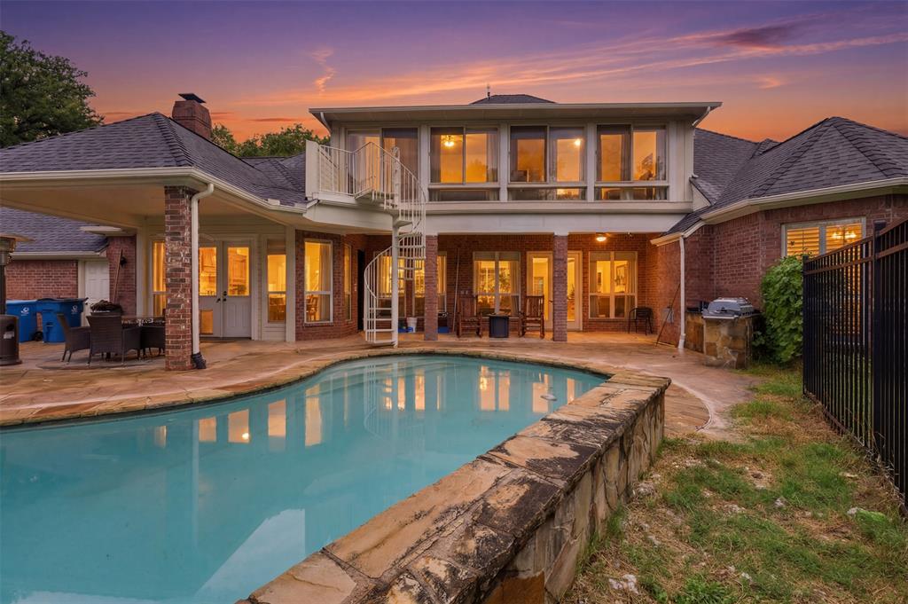 Experience luxury country living in the prestigious Cattlebaron Parc, an exclusive gated equestrian community. Situated on the largest lot in the community—6.653 acres—this exceptional estate offers 5 bedrooms, 4 bathrooms, and a 5-car garage, creating the perfect blend of elegance, comfort, and functionality.
Designed with multi-generational living in mind, the home features a handicap-accessible secondary bedroom on the first floor with a full bath. The chef's kitchen is the heart of the home, showcasing stainless steel appliances, a large center island, breakfast bar, and inviting bar or bistro area, all opening seamlessly to the spacious family room for effortless entertaining.
Step outside to your own private backyard retreat where you'll enjoy a sparkling pool, a heated spa, expansive covered patio, pergola and outdoor kitchen. Relax in the sunroom or outside while watching deer roam the property, creating a peaceful, resort-like setting.
An almost 1,000-square-foot shop with a half bath, electric, and its own water heater offers endless possibilities as a workshop, man cave, pool house, or hobby space. Additional property features include two private wells, a 250-gallon reverse osmosis water filtration system, RV hookup, generator hookup, newer water heater, newer roof and gutters, spray foam insulation, and LED lighting throughout for exceptional energy efficiency.
Residents enjoy exclusive community amenities including a clubhouse, swimming pool, tennis courts, basketball court, and the privacy and security of gated living—all just minutes from downtown Fort Worth.