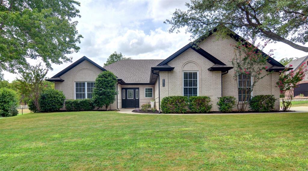 Enjoy all the amenities that come with this updated 3-2-2 home that backs up to the orchard in Pecan Plantation.  The home sits across from the river and within walking distance to Sandy Beach River Park.  The home has an updated kitchen, beautiful flooring, large closets and a great oversized garage for all of your toys.  The master bedroom features a large walk-in closet with new shelving and paint and a roomy ensuite bath with new paint, granite counters and a large mirror.  The back patio has been extended and recently covered to offer a perfect space to entertain or just to relax and enjoy the view!  The living area features a wall of built-in cabinets and a TV that can stay with the home!  The TV, washer, dryer, refrigerator and microwave are provided with the lease.  Just down the road there is a shopping area and activity center with pool, gymnasium, game room, pickleball, and a dog park.  Other amenities include golf, tennis, clubhouse, marina, airparks and more!