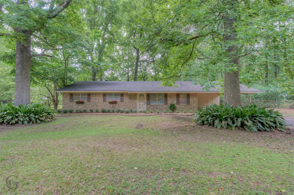 Welcome home! Enjoy the space and privacy of country living on beautiful acreage in Keithville! This 3-bedroom, 2-bath home offers a spacious floor plan with generous living areas, a large primary suite, abundant storage, and a functional kitchen with ample cabinet space and breakfast bar seating. Outside, you’ll find 4 usable acres shaded by mature trees, providing plenty of room for a garden, workshop, recreational vehicles, animals, or future expansion. This home also features a monitored fire and security system, as well as two outdoor storage buildings for added convenience. Whether you’re looking for a peaceful homestead, room to grow, or simply more land to enjoy, this property offers endless possibilities.
