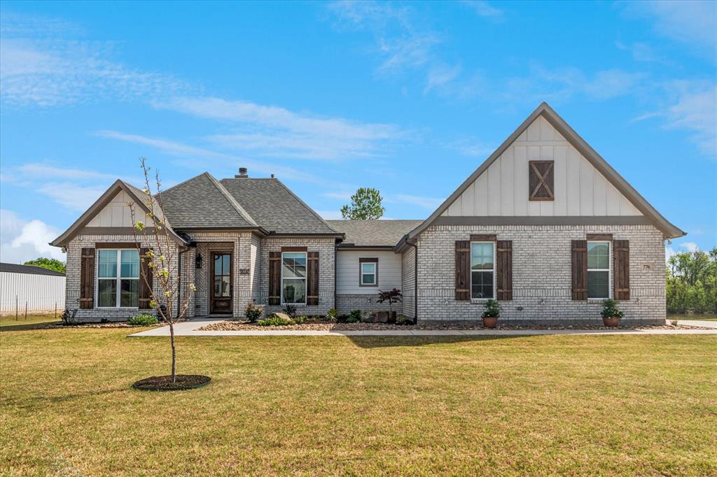 What a wonderful home.  Only a few years old and shows like new.  New class 4roof and gutters were just upgraded. Wonderfully kept home with high ceilings and beautiful wood like tile floors.  Family room is large with a brick fireplace, high ceilings and wonderful windows with views of the backyard and pond. Stained wood in the kitchen really make the island and vent shine along with the white cabinets and granite.  The walk in pantry is enormous with its own cabinets and counter tops. Dining room is in perfect setting open to the kitchen and family area.  Master is great size with very well planned master bath.  Two more bedrooms on other side of home share a full bath.  Entering from garage there is a very well done mud room, with cabinets, drawers and even a work desk.  Backyard is fenced basically to the pond.  Very beautiful home, on 1.5 acres backing up to a pond with plenty of privacy and country living.  Fiber internet gives you best of city and country.