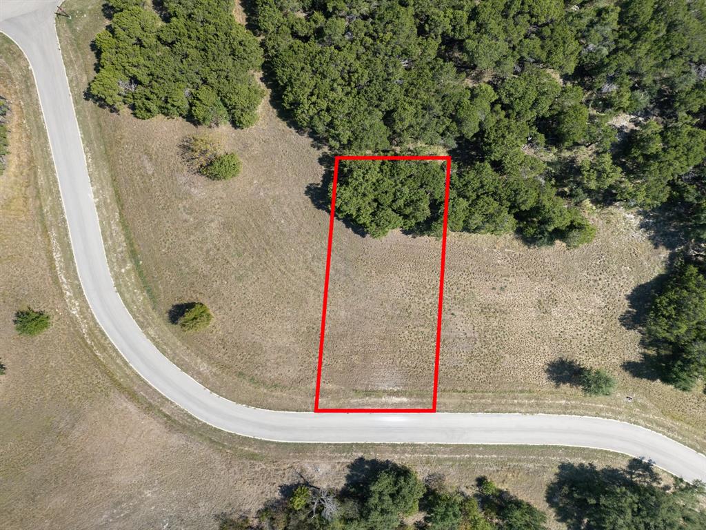 Beautiful 0.25-acre lot in The Retreat, a gated golf community in Cleburne. This cleared and buildable lot offers paved road access with water and electricity at the street (septic required). HOA $600 semiannual. Enjoy resort style amenities including an 18 hole championship golf course, clubhouse, dining, fitness center, pools, tennis courts, walking trails, and 24-hour gated security. Peaceful setting with rolling hills, scenic views, and easy access to Lake Pat Cleburne, Cleburne State Park, and Fort Worth. Buyer and Buyer Agent to verify all information.
