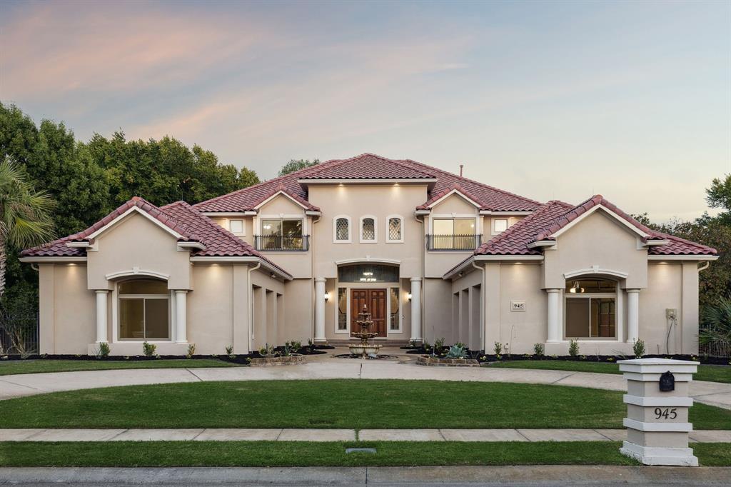 Privately set on nearly an acre of pristine, park-like grounds, this distinguished Southlake Woods estate redefines luxury living through exceptional craftsmanship, serene surroundings & thoughtfully curated updates throughout. From the moment you arrive, the circular drive, manicured landscaping & tranquil pond create a breathtaking first impression. Step inside through the grand doors, where a spectacular dual staircase commands attention. Designed for both grand entertaining & intimate living, the formal rooms exude timeless elegance, while the executive study, complete w-custom BI's, provides the perfect setting for productivity & prestige. Multiple game rooms + a private media rm offer endless options for leisure & entertainment. At the heart of the home lies the chef’s kitchen, appointed w-premium apps, rich cabinetry, newly refreshed cabinet paint & an expansive island ideal for culinary artistry. Every detail has been crafted for beauty & functionality, from the utility room w-a sink to the seamless flow between indoor & outdoor living spaces. The home’s 5 spacious bedrooms, including a rare 1st floor guest suite, provide both privacy & versatility, perfect for multi-generational living or welcoming guests in comfort. Expansive balconies overlook lush grounds, offering serene spaces to unwind & take in the tranquil views. Recent enhancements include a freshly painted full interior, updated kitchen cabinet paint, a 2022 roof, 2023 dual water heaters, and energy-efficient 2024 windows. Outdoors, your private sanctuary awaits. A sparkling pool glistens beneath mature oaks, while the pond & surrounding green space create a resort-like ambiance rarely found within city limits. Whether hosting lavish gatherings or enjoying quiet evenings under the stars, every inch of this property was designed for connection, relaxation & beauty. Great location & in Carroll ISD’s top-rated schools, this estate is more than a home, it’s a statement of enduring luxury & refinement.