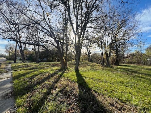 Great corner lot with scattered trees. Would make a wonderful site for that new home.