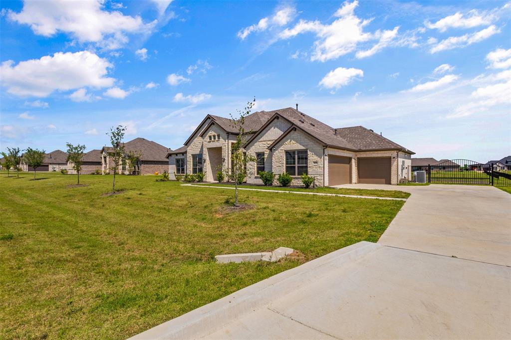 Welcome to 6612 Woodley Ct! Discover this stunning, like-new custom home nestled on over an acre in this sought-after Mesquite community. With 2,665 square feet of thoughtfully designed living space, this 4-bedroom, 3.5-bathroom custom home delivers the perfect blend of elegance, comfort, and room to breathe.

Step inside through the welcoming foyer, where a dedicated office sets the tone for refined living. The open-concept layout reveals impressively tall ceilings throughout the common areas, creating an airy atmosphere that feels both grand and inviting. Rich laminate flooring flows seamlessly through the home, connecting multiple living areas designed for everyday enjoyment and effortless entertaining.

The heart of this home is a gorgeous kitchen featuring an island, walk-in pantry, and gas stainless steel appliances, as well as an extra butler's pantry-coffee area. The primary retreat offers a luxurious escape with a soaking garden tub, separate shower, double vanities, and a spacious walk-in closet. A thoughtfully included mother-in-law suite provides flexible living options for extended family or guests.

Step outside and prepare to be impressed. The expansive backyard offers endless possibilities with room for pets to roam, gardening enthusiasts to flourish, outdoor activities to unfold, or perhaps a future pool to complete the dream. A three-car oversized garage with extra storage rounds out this exceptional property.

**Don't miss this opportunity, schedule your showing today!**