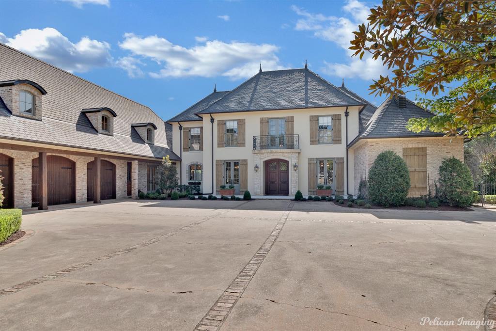 Introducing this stunning, sophisticated manor home w- all the finest finishes & features.Premier location on Gilbert Drive w- over 1.75 acres & gated 
entrance, this home offers superior craftmanship & timeless details.
2 story entry with custom arched doors, formal dining with beautiful wide plank
flooring, living area w- custom limestone fireplace, tile & wood inlay flooring,
windows overlooking grounds.Gourmet kitchen w- all the amenities, open
to keeping room with fireplace & breakfast area.Relaxing primary suite offers
a large walk in closet w- built ins, gorgeous spa inspired bath & more.Lg
family room w wet bar.Upstairs features living area, game media room, exercise room, craft room, 4 bedrooms, 4 baths.Outdoor living area w- covered porch, 
kitchen area overlooking pool area w- beautiful pool house w- living area and
fireplace.Generator, 3 car garage, access to pond area.This exquisitely 
crafted property is a one of a kind offering w extreme quality and privacy.