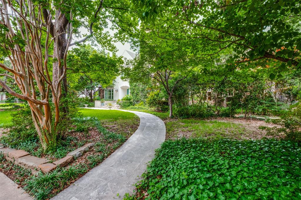3616 Lexington is situated on a ~100 x 200 corner lot nestled under a canopy of Live Oak, Magnolia & Sweetgum trees. This rare interior location in deep Highland Park offers a tranquil retreat just steps from some of HP's most admired parks, community pool, Katy Trail & Knox-Henderson. Built in 1966, the home has been renovated over the years & is ready for a new owner's touch. A gracious entry welcomes you home, flanked by a formal living room and a more casual room w. adjacent sunroom looking out to lush landscaping. Also downstairs are a lg. family room w. wet bar, beautiful dining room & an oversized bedroom. You will love the spacious chef's kitchen w. wood-topped center island, high-end appliances & breakfast area. The upstairs primary suite boasts an adjoining sitting area w. his & her baths. Completing the upstairs are 4 beds with Jack-Jill baths. The backyard retreat is a site to behold with lush trees, an expansive covered porch & an oval pool with natural rock water feature.