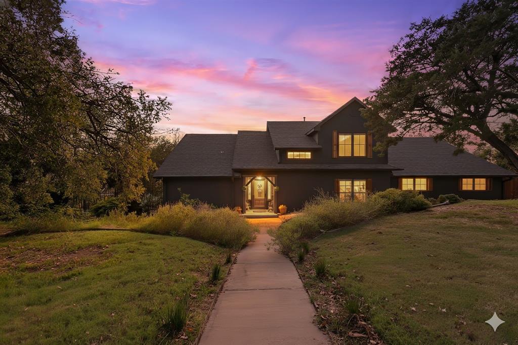 OFFERING $10K TOWARD EXTERIOR STAIRCASE LIFT WITH FULL PRICE OFFER! 

Welcome to your dream waterfront retreat on Lake Granbury! This stunning home offers the perfect blend of modern upgrades, natural beauty, & peaceful privacy. Nestled on over an acre & surrounded by more than 65 mature cedar trees, the property has the feel of a secluded mountain lodge situated on the water’s edge. 

Inside, the home features 2 spacious living areas & a cozy wood-burning stove. Granite countertops run throughout the home with upgraded KitchenAid black stainless-steel appliances in 2023. Beautiful knotty pine stairs lead to the upper level, where you’ll find pine flooring & a private terrace— truly a statement piece of the home. 

The exterior showcases a striking black modern finish with cedar accents, blending contemporary design with rustic charm. The massive covered deck extends across the entire back of the home overlooking low maintenance landscaping that feel like a private oasis. 

This waterfront haven features a double spiral staircase that leads down to a recreational paradise. Enjoy 3 concrete boat slips, 2 of which are covered, convenient kayak storage, & multiple spots to relax right by the lake. The fully heated, cooled, & insulated 16'x24' workshop, 2-car garage with upgraded modern doors, & additional covered parking offer plenty of room for all your lake toys. 

Recent updates include a Class 4 roof added in 2020, a 4.5-ton AC unit in 2022, a fully decked attic running the entire length of the house, & a 12-zone irrigation system that can pull from the lake! Community residents enjoy access to tennis courts, pickleball courts, a picnic area, a pool, & a private boat ramp. 

Perfectly situated on a lake that never runs dry, this one-of-a-kind property is ideal as a full-time residence, weekend getaway, or high-performing investment with short-term rentals permitted. Schedule your private showing today & experience Lake Granbury living at its best!