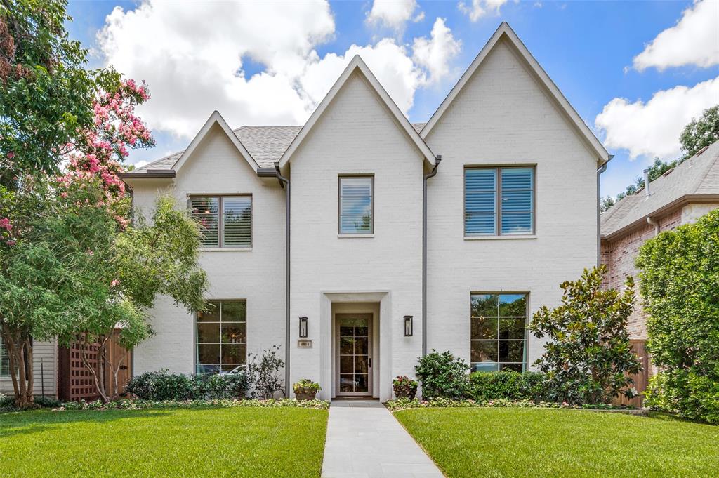This is the best value in Briarwood and Bluffview. The all-brick exterior and immaculate landscaping create a captivating first impression, hinting at the luxurious details. As you cross the threshold, gorgeous hardwood floors guide you into a welcoming foyer with a refined dining room and a stylish office on either side. The main living area is the true showstopper, featuring a stunning beamed ceiling, custom bookshelves, a charming fireplace, and expansive wall-to-wall glass doors that invite natural light and views of the outdoors. The open-concept layout effortlessly connects this space to the gourmet kitchen, a chef's dream with its spacious island, custom cabinets, premium appliances, a walk-in pantry, and a dedicated office workstation for added convenience. The primary suite is a tranquil retreat, offering a generously sized bedroom with a calming... see private remarks for additional details