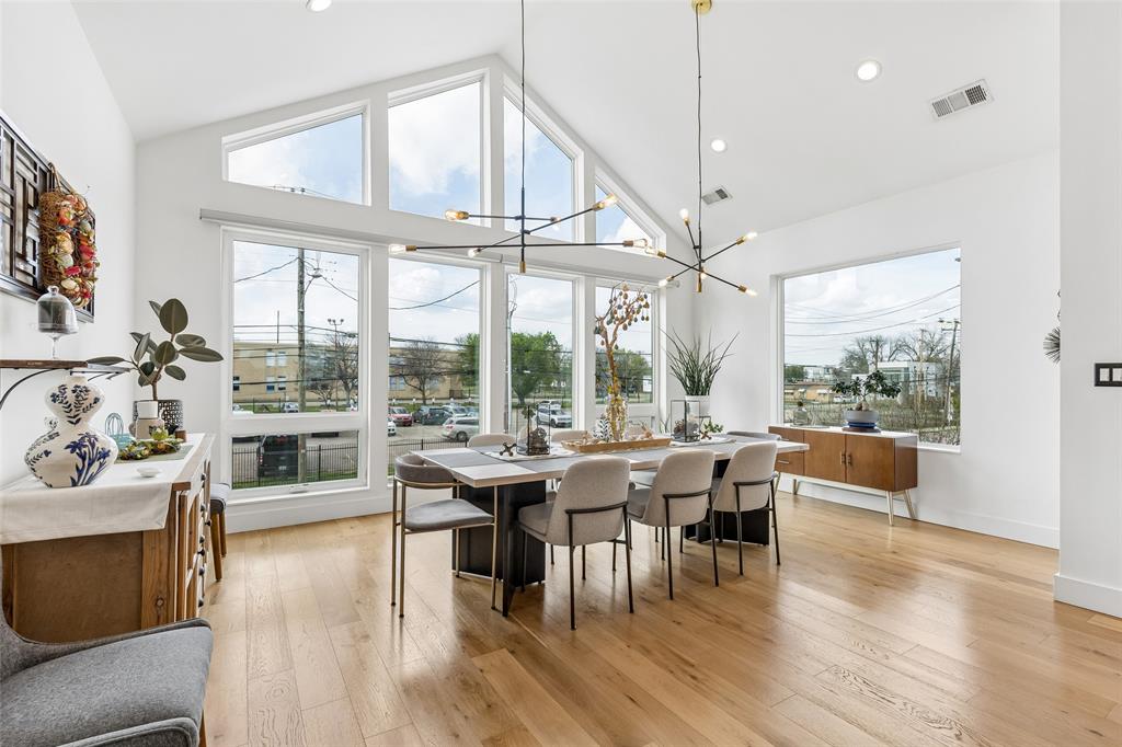 MAJOR PRICE IMPROVEMENT! STUNNING single-family attached home WITH A POOL in the heart of East Uptown just moments from The Central, one of the city’s most transformative new mixed-use developments. Ultimate lock and leave with a custom oasis pool! Designed for elevated living and sophisticated entertaining, this two story townhome features dramatic soaring ceilings in the main living area, with floor to ceiling windows, genuine hardwood floors, and museum finished walls. The refined look is enhanced by electronic filtered blinds, custom lighting and curated architectural details. The state-of-the-art kitchen anchors the home with a striking Quartz waterfall island, stainless steel appliances, gas range, double ovens, custom wood accents, and sleek contemporary fixtures, blending form and function. The first level features two ample sized bedrooms ideally suited as offices, media or guest rooms and an expansive primary suite which overlooks the private, resort-style pool. The spa-inspired primary bath showcases an open-concept wet room design with a freestanding soaking tub, elevated shower features, and custom motion-activated lighting. Custom closets, a well designed laundry room and a dual HVAC systems provide optimal efficiency and comfort year-round. Impressive outdoor living features a private balcony off the living room which overlooks the custom-built pool and features a slate fireplace - seamless extension of the interior living space. The beautiful heated and chilled pool is finished with opalescent tile and a waterfall feature, delivering year-round enjoyment and a boutique-hotel ambiance rarely found in Uptown townhomes. Additional highlights include an attached two-car garage with epoxy-coated flooring and upgraded storage systems. A rare opportunity to own a one-of-a-kind luxury townhome with private pool in East Uptown, located in a rapidly appreciating neighborhood. Meticulously designed, architecturally striking and no detail overlooked!